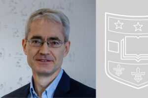 geoffrey goodhill with a gray and white washington university school of medicine shield in the background