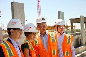 Jin-Moo Lee, MD, PhD, head of the neurology department; Linda Richards, PhD, head of the neuroscience department; David Holtzman, MD, past head of the neurology department; Gregory Zipfel, MD, head of the neurological surgery department, in hard hats and orange vests