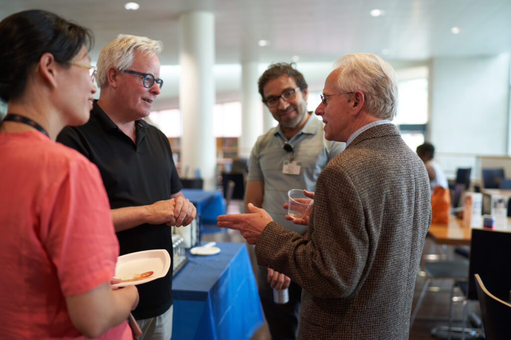 Yao Chen, Paul Shaw, and Paul Bridgman talking