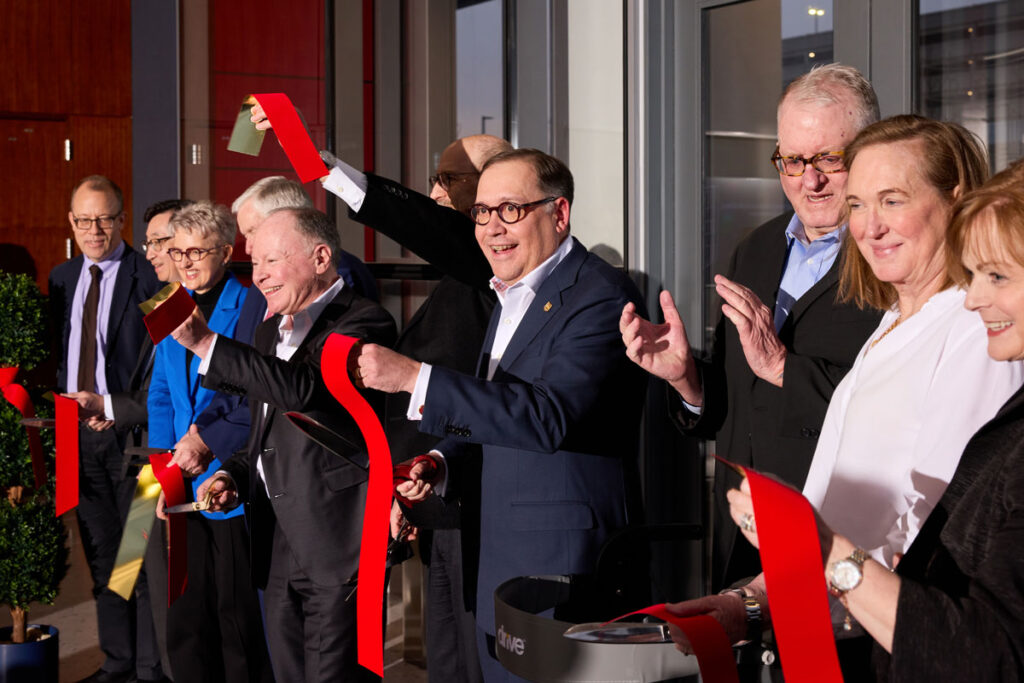 Participants in the dedication Jan. 18 of the Jeffrey T. Fort Neuroscience Research Building celebrate a ribbon-cutting at the new Washington University Medical Campus building. From left are: Eric Lenze, MD, head of the Department of Psychiatry and the Wallace & Lucille Renard Professor of Psychiatry; Jin-Moo Lee, MD, PhD, head of the Department of Neurology and the Andrew B. & Gretchen P. Jones Professor of Neurology; Linda J. Richards, PhD, head of the Department of Neuroscience and the Edison Professor of Neuroscience; Missouri Gov. Mike Parson; Andrew M. Bursky, chair of the university’s Board of Trustees; David H. Perlmutter, MD, the George and Carol Bauer Dean of Washington University School of Medicine; Chancellor Andrew D. Martin; Jeffrey T. Fort; Fort’s sister, Liz Dorr; and Pamella A. Henson, executive vice chancellor of University Advancement.