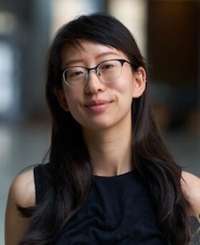 Julia Pai is a woman with dark hair and wearing glasses.