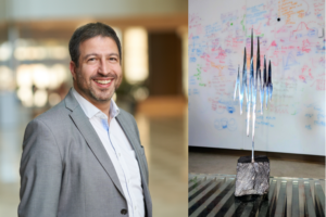 Adam Kepecs and the Buzsaki Lecture Award stature--a metal sculpture of a sharp wave ripple