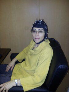 Marlene Behrmann wearing an EEG cap
