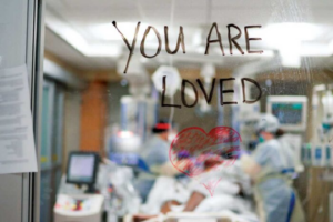 A message of love and support is written on glass in the intensive care unit at Barnes-Jewish Hospital during the height of the COVID-19 pandemic in 2020.