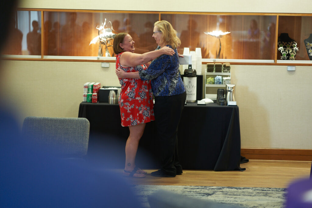 Mary Heeley and Tami Evans hugging